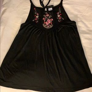 Black float tank with lace floral details